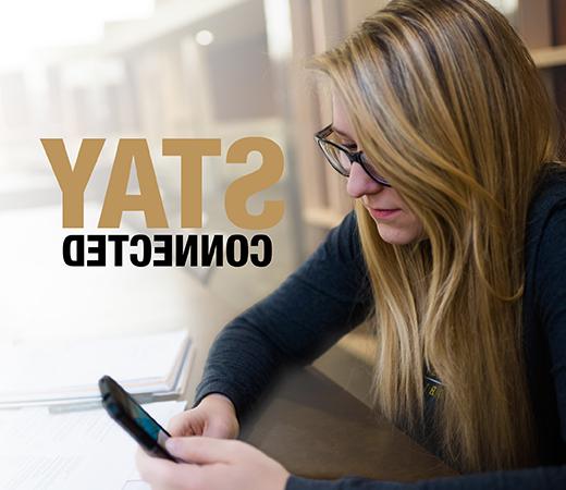 A student on their phone, with words to the right of her that read "Stay Connected"